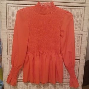Orange smocked shirt